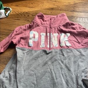 pink quarter zip with holographic logo